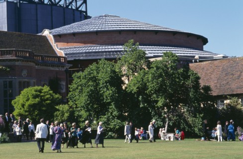 ENGLAND, East Sussex, Glyndebourne, "New theatre, exterior with audience members crossing the lawn