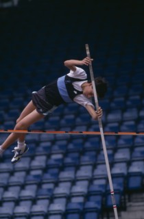 10037064 SPORT Athletics  Pole Vault Competitor in junior athletics championship at Crystal Palace clearing bar in pole vault.