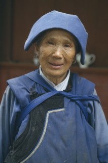 CHINA, Yunnan, Baisha, Naxi lady in traditional blue clothes