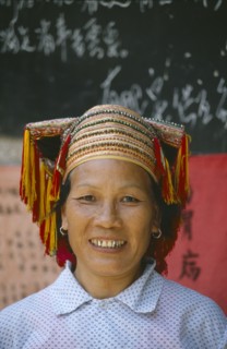 CHINA, Guangxi, Sanjiang, Dong lady  with gold teeth wearing traditional head-dress