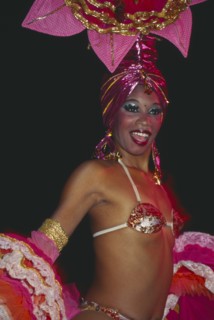 CUBA, Havana Province, Havana, Tropicana Club female dancer in pink costume