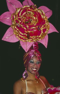CUBA, Havana Province, Havana, Tropicana Club female dancer in pink costume with pink head-dress in