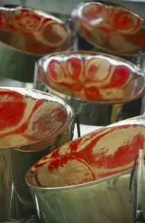 WEST INDIES, Tobago, Detail of steel band drums with red reflections