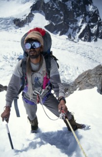 10029912 SPORT Climbing Mountaineering Pakistan.  Porter climbing to camp 1 on K2.