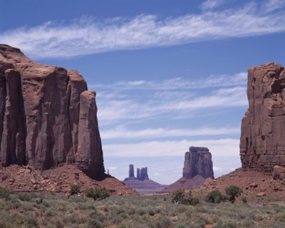 USA, Arizona, Monument Valley, The North Window View through rock features to isolated mesa and