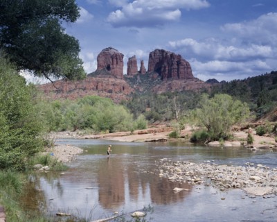 USA, Arizona, Sedona, Cathedral Rock in Oak Creek Canyon. View across river towards wind eroded