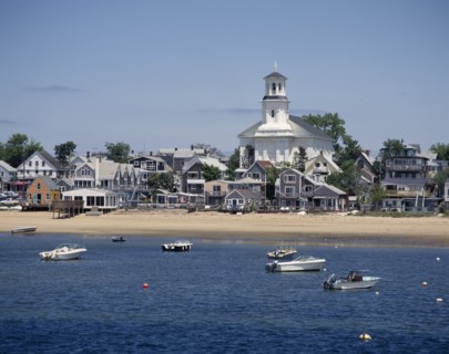 USA, Massachusetts, Cape Cod, Provincetown. The beach with houses along the sand and small boats at