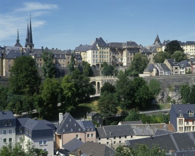 LUXEMBOURG, Luxembourg City, General view across the city rooftops showing city walland distant