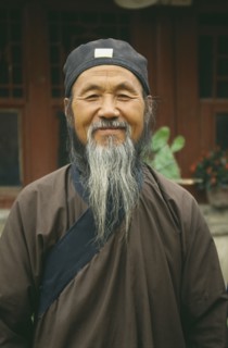 CHINA, Inner Mongolia, Hohhot, Head and shoulders portrait of Taoist / Daoist priest