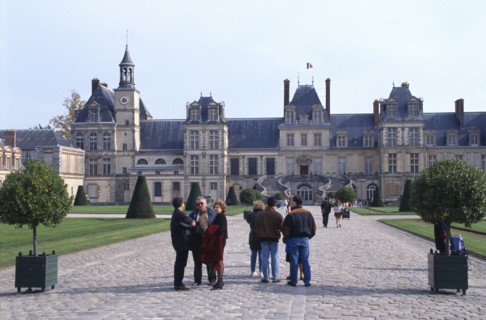 FRANCE,  , Fontainebleau, Palace of Fontainebleau with tourists in courtyard