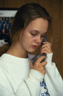 COMMUNICATIONS, Telephone, Using,  Girl using phone at home.
