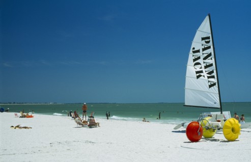 USA, Florida, St.Petersburg, Hobbie cats and pedalos on beach.