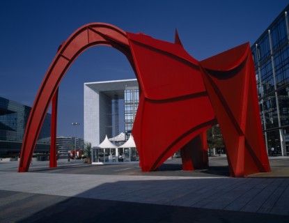 FRANCE, Ile de France, Paris, La Défense.  La Grande Arche framed by red modern sculpture.