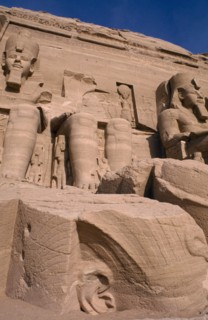 EGYPT, Abu Simbel, Three of the four giant statues of Ramesses II at the entrance of the Great