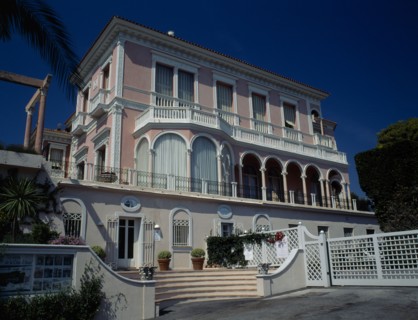 FRANCE, Cote d’Azur, Near Nice, Villa Ephrussi de Rothschild with pink walls and white balconies.