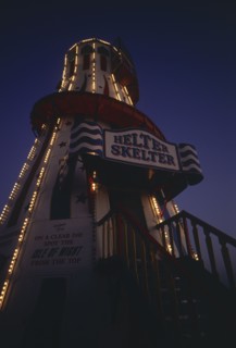 ENGLAND, East Sussex, Brighton, The helter skelter on Brighton Pier illuminated at night