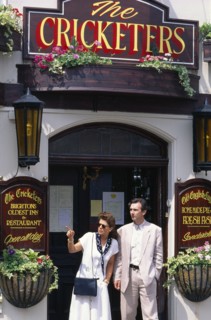 ENGLAND, East Sussex, Brighton, Couple leaving the Cricketers pub.