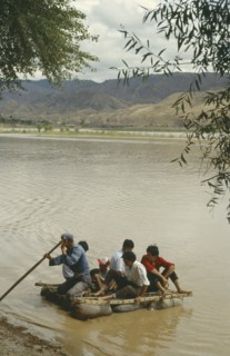 CHINA, Yellow River, People traveling off on a Hide Raft
