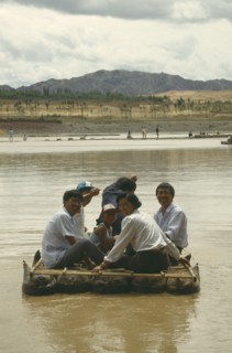 CHINA, Yellow River, People traveling down river on Hide Raft
