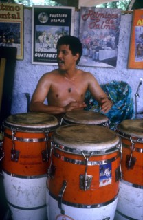 CUBA, Music, Drummer sitting behind large red and white drums