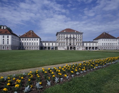 GERMANY, Bavaria, Munich, Nymphenberg Palace. View over lawns and border of yellow marigolds