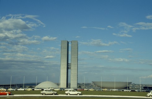 BRAZIL, Federal District, Brasilia, Palace of National Congress buildings seen over road in the