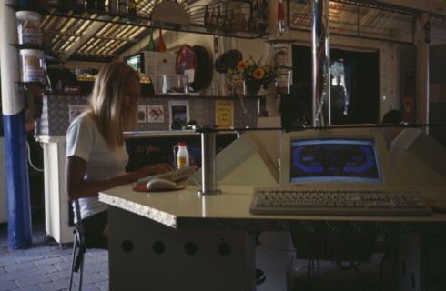 COMPUTERS , World Wide Web, Internet Cafe, AUSTRALIA Byron Bay. Internet cafe with girl at computer