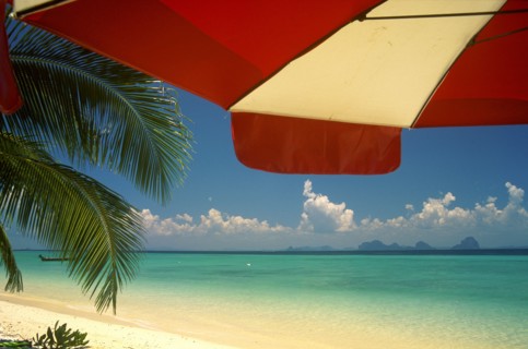 THAILAND, Trang Province, Koh Hai, Koh Kraddan in the distance across clear calm blue sea seen from