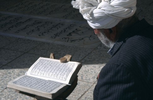 IRAN,   , Yazd, Man reading Koran