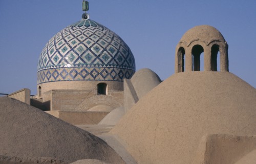 IRAN, Yazd, View over rooftops and dome of the Old city Mosque