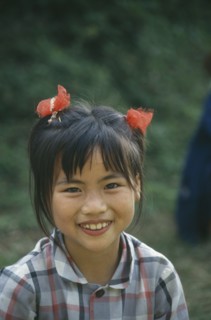 CHINA, General, People, Young girl with ponytails smiling