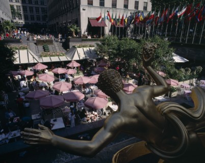 USA , New York State, New York, "Rockefeller Centre, open air cafe with pink umbrellas and gold
