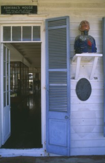 WEST INDIES, Antigua, Nelson’s Dockyard, Admirals House doorway with wooden carving of naval