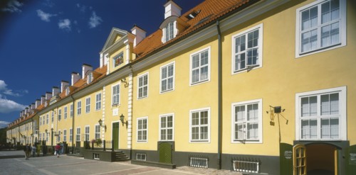 LATVIA,  , Riga, Swedish Gate. Row of bright yellow terraced houses