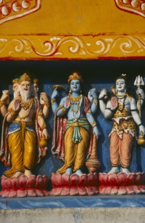 INDIA, Orissa, Gopalpur on Sea, Detail of colourful temple carvings depicting Hindu Gods