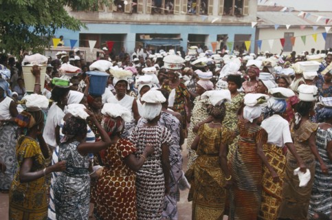 GHANA, Larteh, NOT IN LIBRARY Women carrying offerings on their heads at the Golden Jubilee