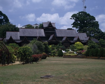 MALAYSIA, East Coast, Malacca, The Sultans Palace viewed from across green lawn with flowers and