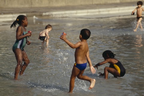 ENGLAND, London, Kids playing Clapham paddling pool.