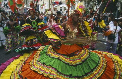 ENGLAND, London, Notting Hill Carnival, Dancers in costume during parade.
