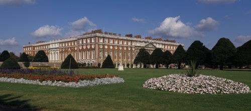 ENGLAND, London, Hampton Court Palace. General view seen across formal gardens