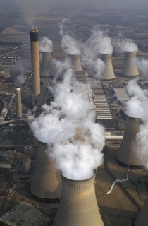 ENGLAND, North Yorkshire, Drax, Aerial view over cluster of Power Station chimneys releasing white