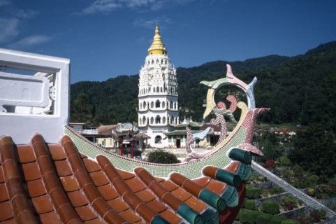 MALAYSIA, Penang, Kek Lok Si Temple, View over rooftop detail toward white tower with golden roof