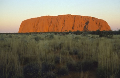 AUSTRALIA, Northern Territory, Uluru, Ayers Rock at sunset.