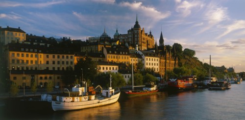 SWEDEN, Stockholm, Evening shot of the waterfront area with boats moored