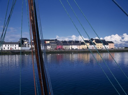 IRELAND, County Galway, Galway City, View across the River Corrib toward colourful houses near the
