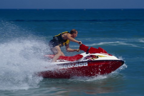 20001991 SPORT Water Sports Jet Ski Person on a red jet ski in action