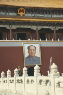CHINA, Hebei, Beijing , Policeman standing under a picture of Chairman Mao