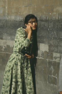 CHINA, Hebei, Beijing, Temple of Heaven.Woman standing next to wall