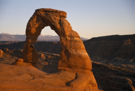 USA, Utah, Arches National Park, "Delicate Arch. Free standing, red cresent of rock at canyon edge.
