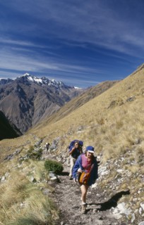 PERU, Cusco Department, The Inca Trail, Treckers with back packs walking up Dead Woman´s Pass.